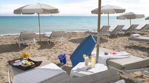 On the beach, beach cabanas, sun-loungers, beach umbrellas