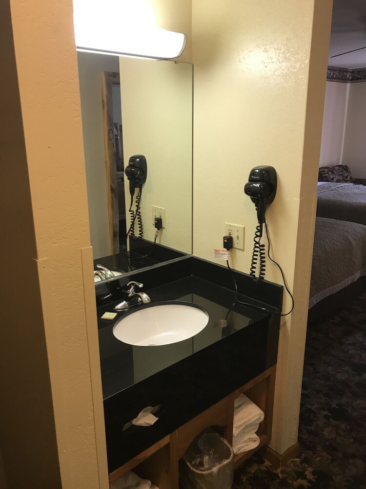 Bathroom sink, Super 8 by Wyndham Bridgeview of Mackinaw City