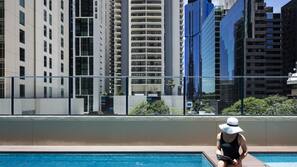 Outdoor pool, open 7:00 AM to 9:00 PM, pool loungers