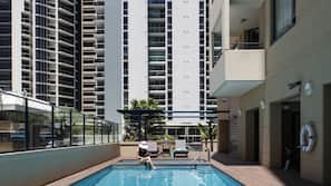 Outdoor pool, open 7:00 AM to 9:00 PM, pool loungers