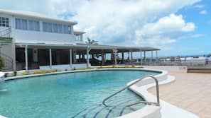 Outdoor pool, open 7:00 AM to 7:00 PM, pool umbrellas, pool loungers