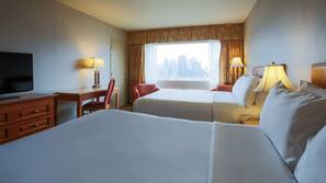 Premium bedding, desk, laptop workspace, blackout curtains
