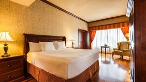 Premium bedding, desk, laptop workspace, blackout curtains