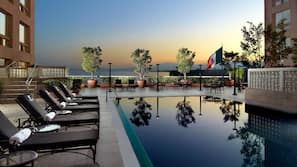 Outdoor pool, pool umbrellas, sun loungers