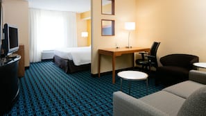 Premium bedding, desk, laptop workspace, blackout drapes