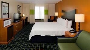 Hypo-allergenic bedding, desk, laptop workspace, blackout drapes