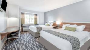 Premium bedding, pillow top beds, desk, laptop workspace
