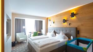 Premium bedding, desk, laptop workspace, blackout drapes