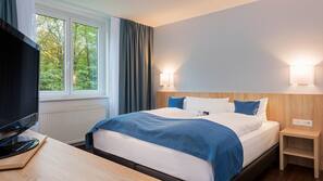 Hypoallergeen beddengoed, een kluis op de kamer, een bureau