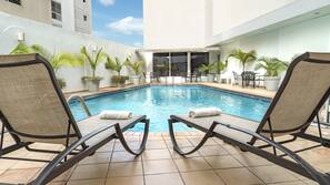 Outdoor pool, open 7:00 AM to 11:00 PM, sun loungers