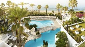 3 outdoor pools, open 10:00 AM to 7:00 PM, pool umbrellas, pool loungers