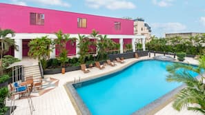Outdoor pool, open 7:00 AM to 9:00 PM, pool umbrellas, pool loungers