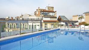 Outdoor pool, pool umbrellas, pool loungers