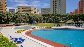 Indoor pool, outdoor pool, pool umbrellas