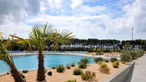 Indoor pool, outdoor pool, pool umbrellas