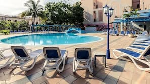 Outdoor pool, open 10 AM to 6 PM, pool umbrellas