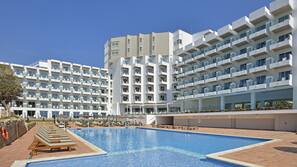 3 outdoor pools, open 8 AM to 8 PM, pool umbrellas, pool loungers