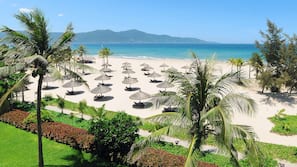 Private beach, white sand, sun loungers, beach umbrellas