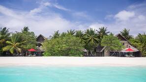 Private beach, white sand, sun loungers, beach umbrellas