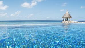 Private beach, white sand, free beach cabanas, sun loungers