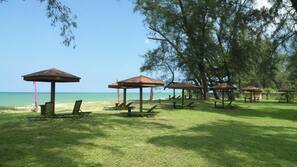 On the beach, free beach cabanas, beach umbrellas