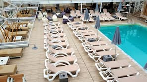 Seasonal outdoor pool, open 11 AM to 7 PM, pool umbrellas, sun loungers