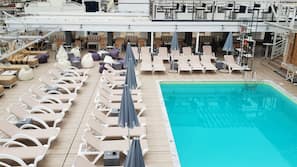 Seasonal outdoor pool, open 11 AM to 7 PM, pool umbrellas, sun loungers