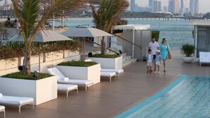 Private beach, white sand, sun loungers, beach umbrellas
