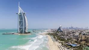 Private beach, white sand, sun loungers, beach umbrellas