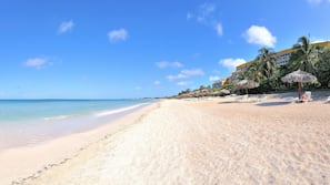 On the beach, sun loungers, beach towels, scuba diving