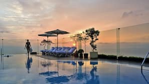 Outdoor pool, open 6:00 AM to 10:00 PM, pool umbrellas, pool loungers