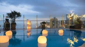 Outdoor pool, open 6:00 AM to 10:00 PM, pool umbrellas, pool loungers