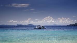Private beach, white sand, sun-loungers, beach umbrellas
