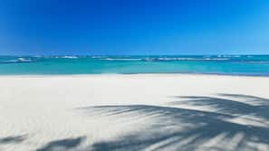 On the beach, sun loungers, beach umbrellas, beach towels