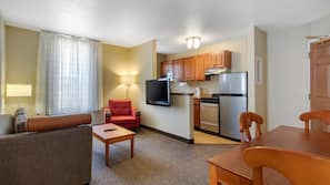 Desk, laptop workspace, blackout drapes, iron/ironing board