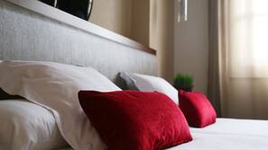 Ropa de cama de alta calidad, minibar, caja fuerte y escritorio