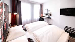 Luxe beddengoed, een minibar, een kluis op de kamer, een bureau