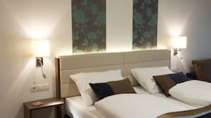 Luxe beddengoed, een minibar, een kluis op de kamer, een bureau