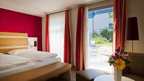 Luxe beddengoed, een minibar, een kluis op de kamer, een bureau