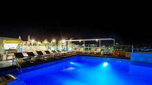 Seasonal outdoor pool, open 10:30 AM to 8:00 PM, pool umbrellas