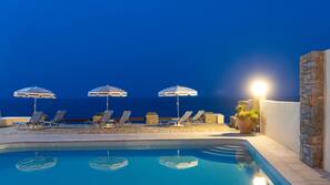 Seasonal outdoor pool, open 9 AM to 8 PM, pool umbrellas, pool loungers
