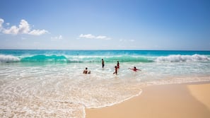 On the beach, sun loungers, beach umbrellas, beach towels