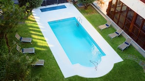 Seasonal outdoor pool, pool loungers