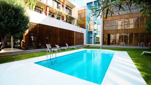 Seasonal outdoor pool, pool loungers