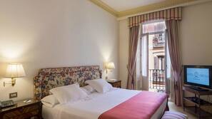 Ropa de cama de alta calidad, minibar, caja fuerte y escritorio