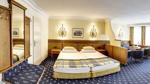 Ropa de cama hipoalergénica, minibar, caja fuerte y escritorio