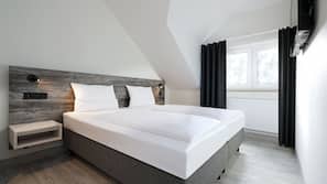 Een kluis op de kamer, verduisterende gordijnen, gratis wifi, beddengoed
