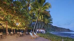 On the beach, black sand, free beach shuttle, sun loungers