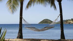On the beach, white sand, free beach cabanas, sun-loungers