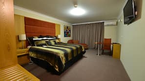 Minibar, desk, laptop workspace, iron/ironing board